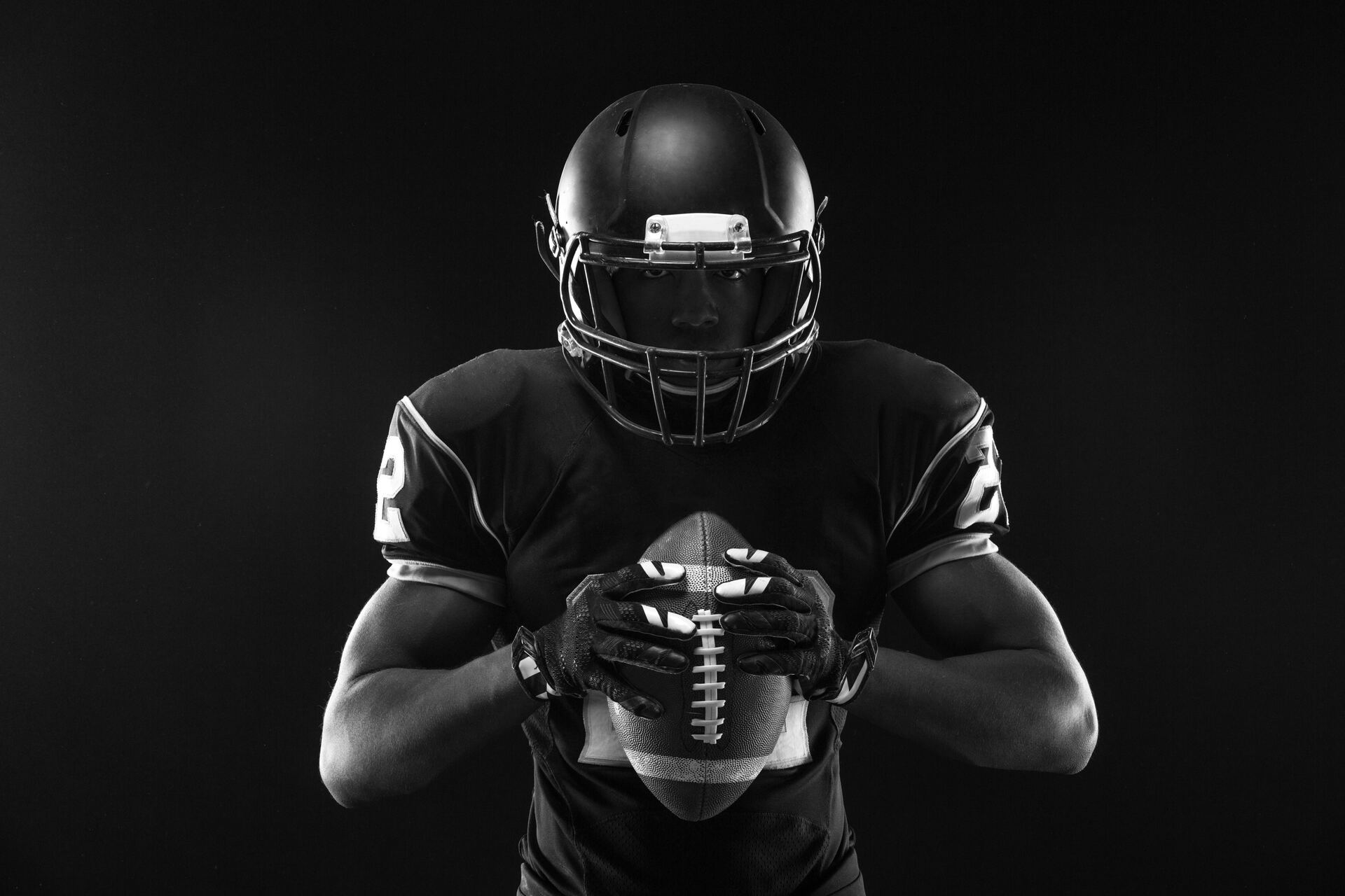 Football player holding the ball